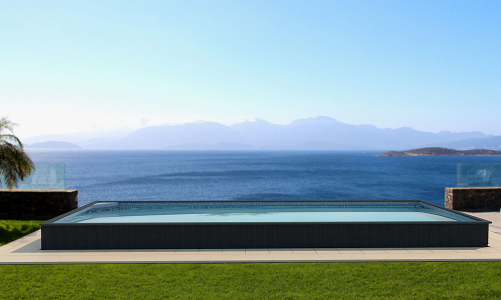 Partially inground 16x40 container pool with stone surround