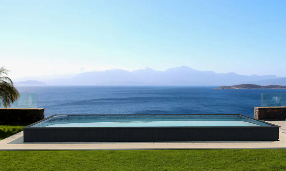 Partially inground 16x40 container pool with stone surround
