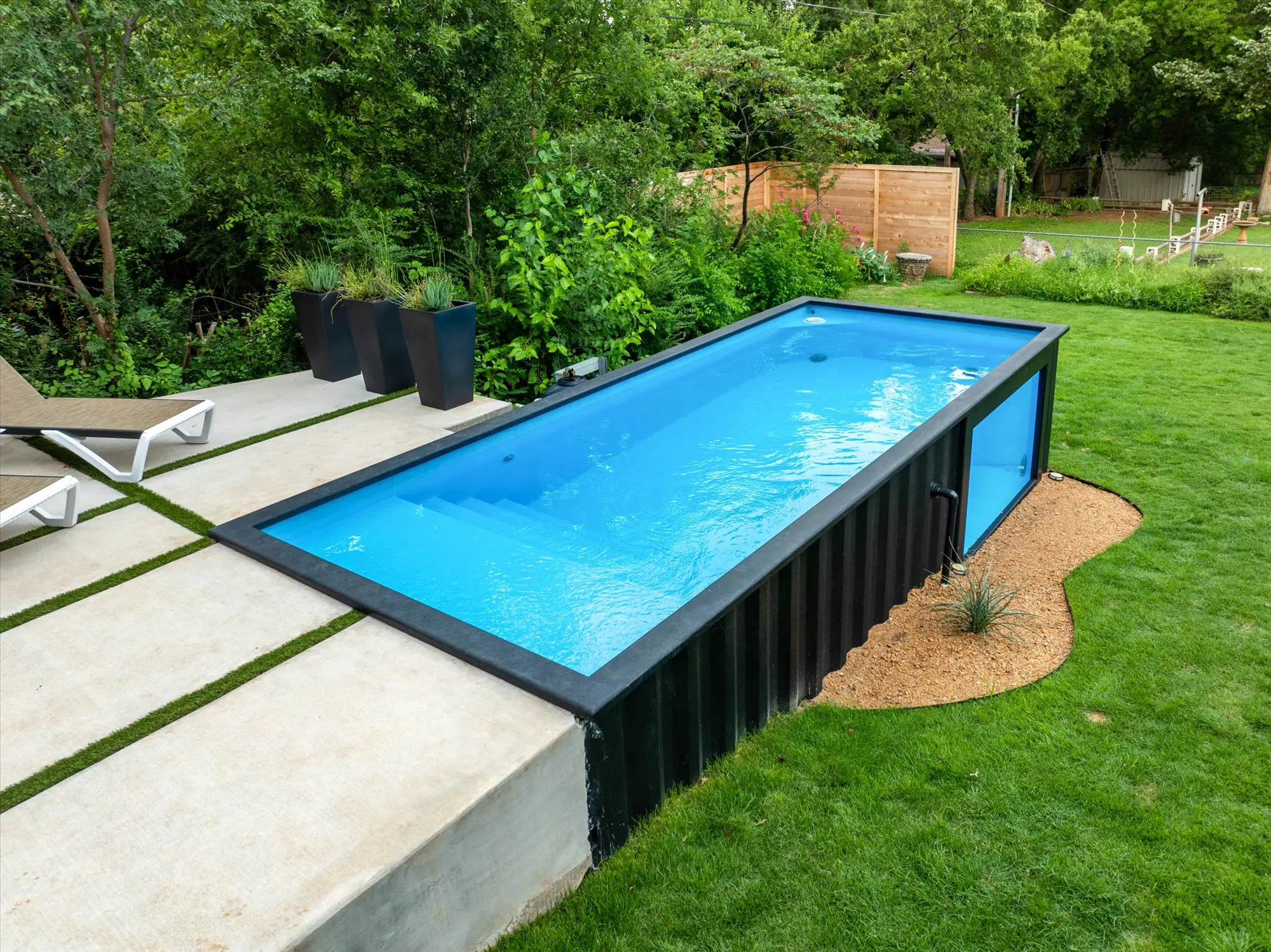 Container pool installation in Oklahoma with acrylic window - wide shot