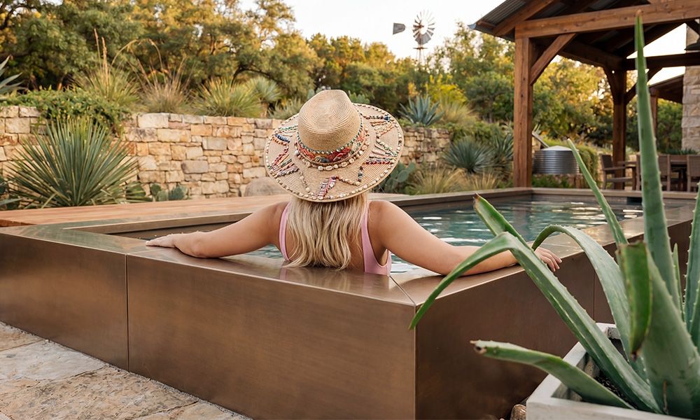 Woman relaxing in a steel cowboy pool
