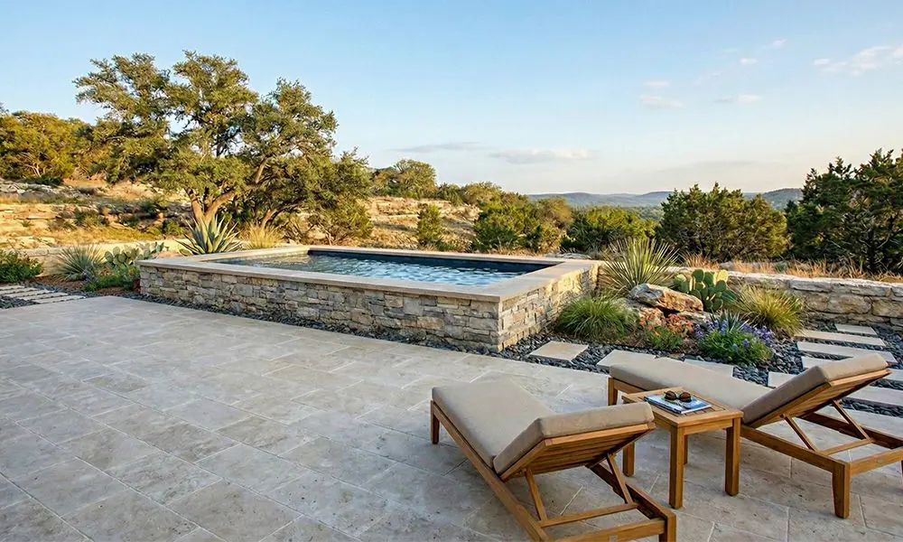 Semi-Inground Pool with Rock Surround Showing Steel Construction