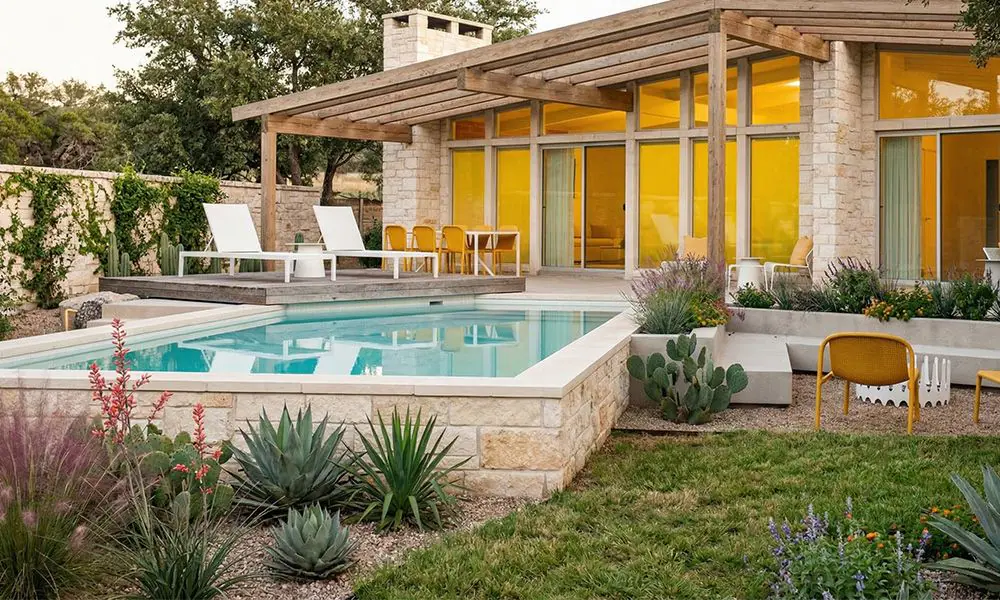 Semi-Inground Ecopool with Modern Limestone Finish