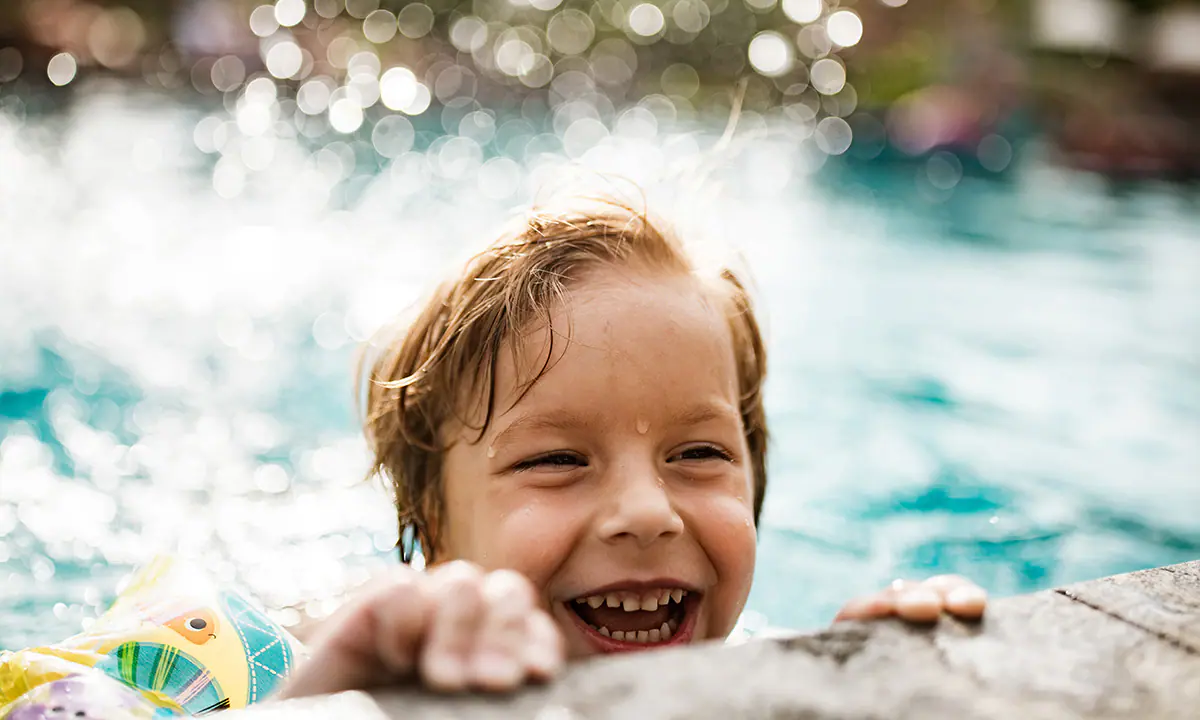 Kid swimming in pool